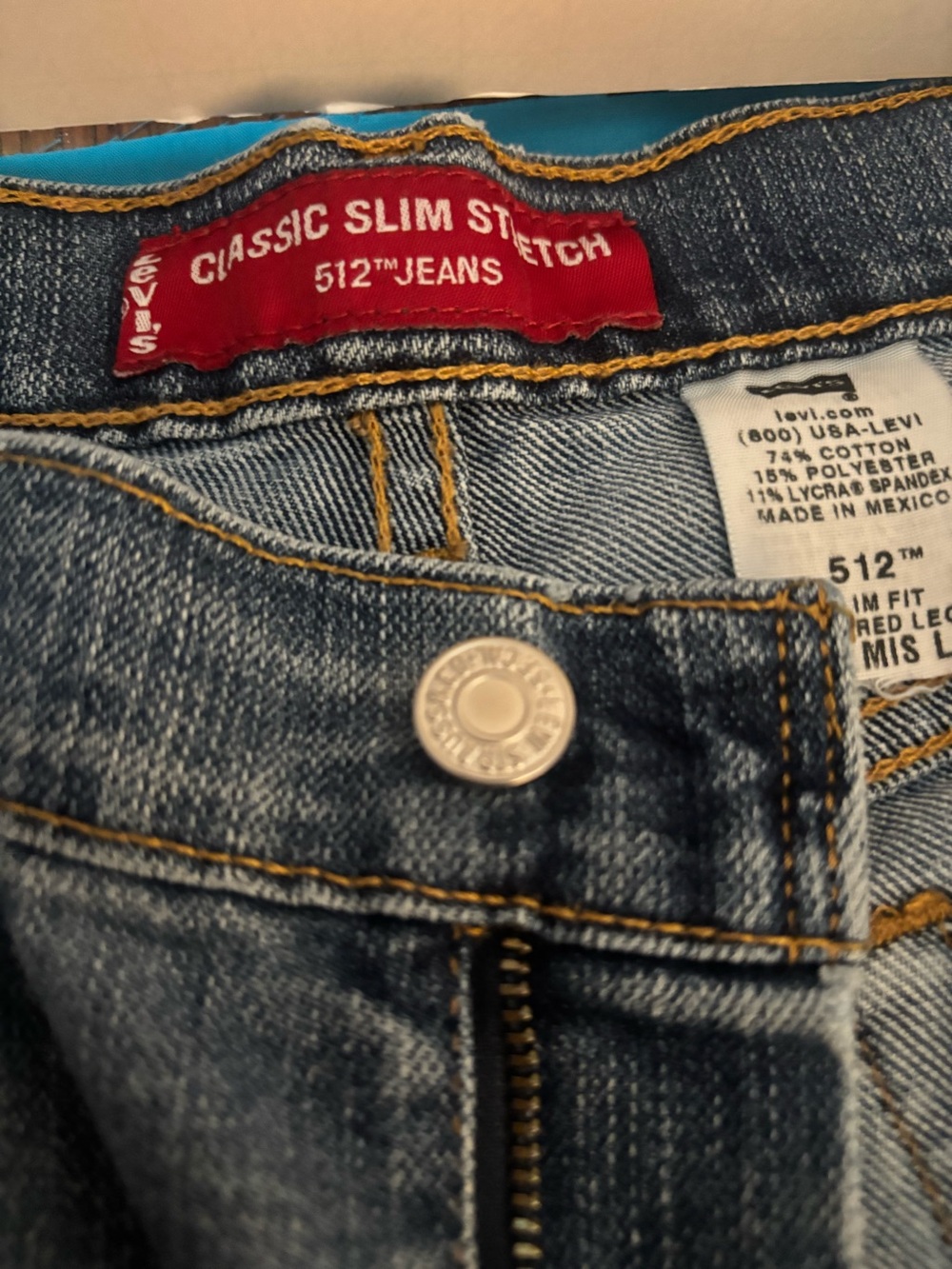 Levi's light blue denim jeans with gold stitching
